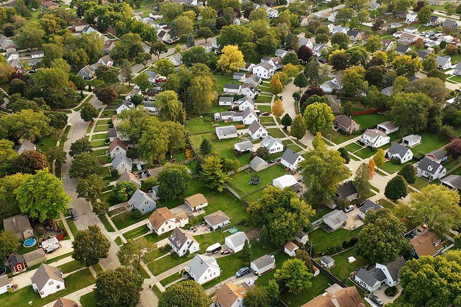 Delavan, WI - Aerial View of a Community of Suburban Homes During a Bright Day